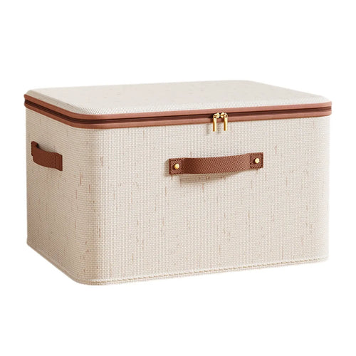 Beige fabric storage box with a zippered lid, brown trim, and front and side handles.