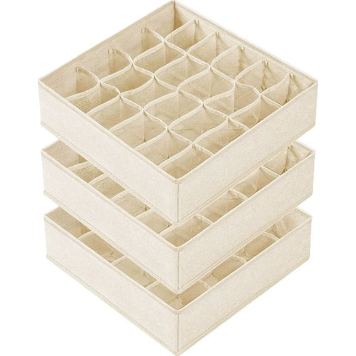 Stack of three beige fabric drawer organizers with multiple storage compartments.